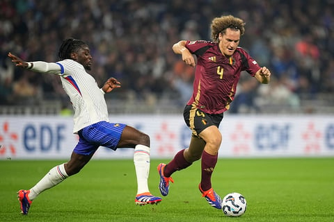 2024–25 UEFA Nations League, France vs Belgium: France's Manu Kone, left, tries to stop Belgium's Wout Faes